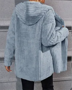 Back view detail of blue fuzzy hooded jacket with vertical ribbed texture for winter