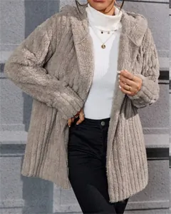 Detail view of a fuzzy vertical striped hooded jacket in soft warm arctic velvet fabric.