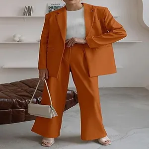Detailed view of women's burnt orange professional blazer and wide-leg trouser suit