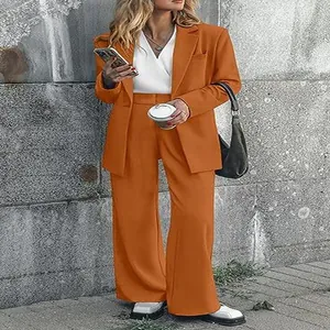 Fashionable orange women's professional suit set featuring a tailored blazer and wide-leg trousers