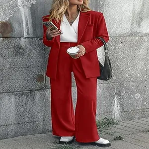 Detailed professional view of women's red tailored blazer and wide-leg trousers set