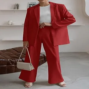 Detailed view of professional red women's blazer and matching wide-leg pants set