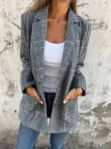 Detailed view of women's casual vintage plaid blazer with front pockets and lapel
