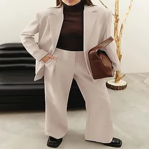 Professional women's beige blazer and wide-leg trouser suit for elegant business casual look
