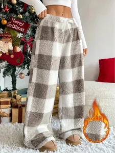 Detailed view of the soft fleece-lined fabric on these plaid winter pajama pants