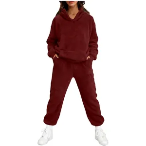 Detail view of wine red fuzzy fleece material on a full hoodie and pants loungewear set