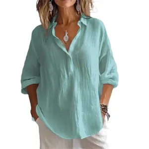 Close-up detail of the mint green loose-fit casual linen blouse with elegant V-neck design.
