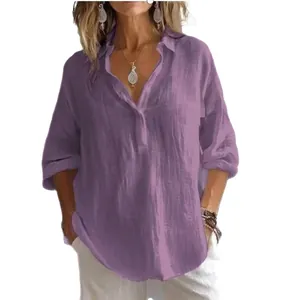 Close-up detail of a women's purple loose linen shirt featuring a V-neck and long sleeves