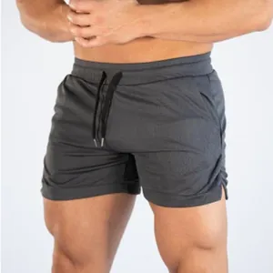 Detailed view of breathable dark grey athletic gym shorts for men with elastic drawstring waist