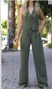Full-length shot of olive green V-neck vest and wide-leg trousers casual set.