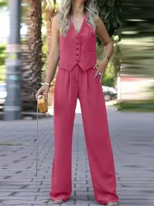 Two-piece pink vest and wide-leg trouser suit for elegant spring fashion