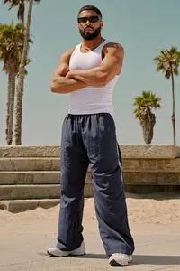 Loose men's breathable navy trousers with white side stripes for summer casual wear