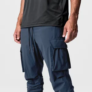 Close-up detail of men's dark blue ice silk cargo joggers with functional side pockets