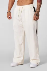 Men's loose fit white casual pants with side black stripes and drawstring waist