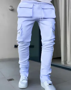 Detail view of men's blue reflective cargo pants with multi-pockets and zippers