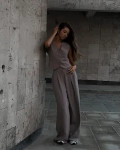 Detailed view of women's sleeveless V-neck vest and matching wide-leg trousers suit