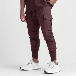 Premium men's burgundy cargo joggers featuring multi-pocket design and elastic ribbed cuffs