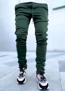 Detail view showing men's olive green reflective cargo pants with slim athletic fit