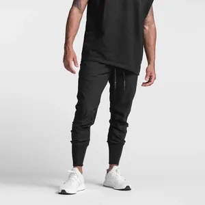Men's black fitness joggers featuring ribbed cuffs and an adjustable drawstring waist