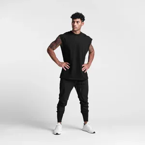Full-body view of men's athletic joggers in black with tapered cuffs and drawstring
