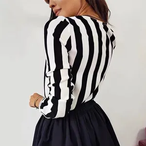 Detail shot of a women's black and white vertical striped chiffon long-sleeved blouse.