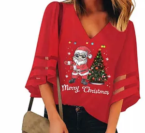Detail view of women's red Christmas blouse with Santa print and mesh splicing bell sleeves