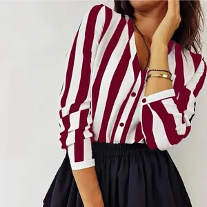 Detail showing the red and white vertical stripe pattern on a long-sleeved chiffon shirt.