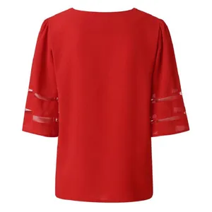 Back view of stylish red V-neck blouse featuring elegant mesh stitching on short sleeves