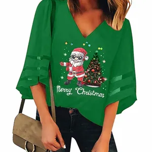 Detail view of women's green Santa Claus print V-neck top with stylish mesh bell sleeves