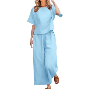 Light blue two-piece lounge set with relaxed short sleeve top and wide leg trousers