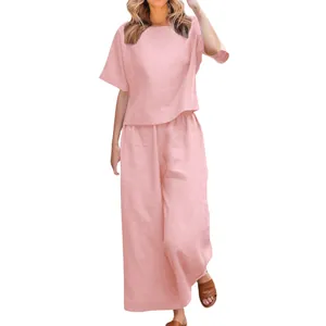 Detailed view of this loose-fitting pink short-sleeved top and wide-leg pant lounge set.