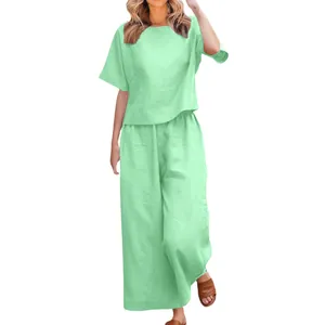 Mint green two-piece casual set featuring a loose top and wide-leg trousers for women