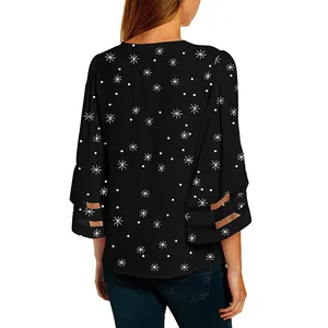 Womens festive black blouse featuring white star print and mesh flare sleeves back view