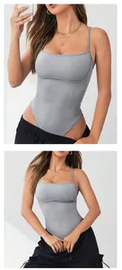 Close-up of a seamless gray knitted yoga bodysuit on a fitness model.