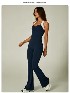 Full-body view of a navy blue flare leg jumpsuit with white color-blocking straps.