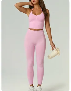 Detailed view of model wearing pink halter neck yoga set with high waist compression leggings