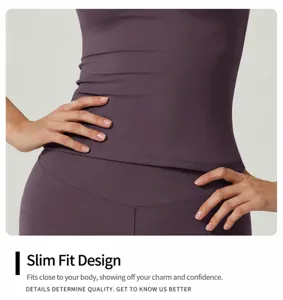 Close-up detail of a slimming dark purple yoga top showing elastic dry-fit fabric texture