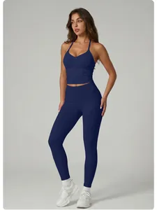 Professional navy blue yoga set featuring a halter neck top and high-waisted leggings