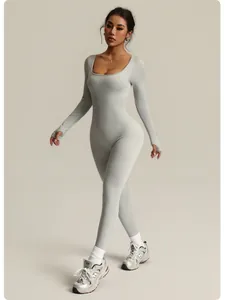 Slim fit seamless ribbed long sleeve yoga jumpsuit shown on an Asian fitness model.