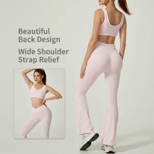 Pink high-waisted flared yoga set with color-block sports bra and open back design