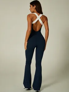 Navy and white color-block backless yoga jumpsuit with flare legs and cross straps