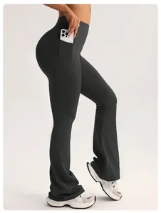 Detail shot of high-waisted black flare yoga pants with side pocket and butt lift