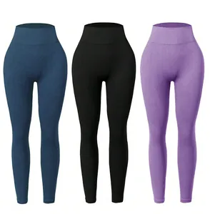 Close-up of high-waist yoga leggings showing rib-knit texture in three colors