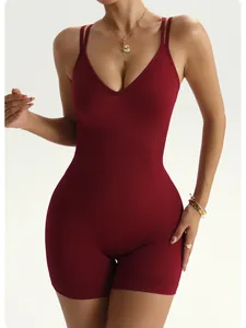 Detail of wine red ribbed yoga bodysuit with sexy double cross back straps.