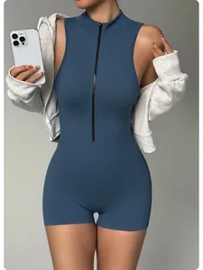 Detailed view of a dusty blue sleeveless yoga romper with a front zipper for women