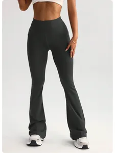 Detail of dark gray high-waisted flare yoga pants for women featuring a peach-lift fit