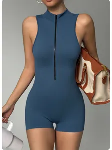 Close-up detail of blue sleeveless fitness yoga romper featuring a black front zipper