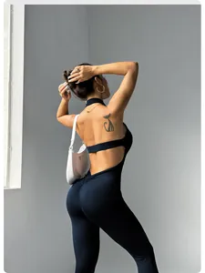 Detailed view of backless yoga jumpsuit with scrunch butt design in navy blue