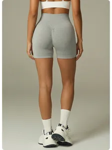 Back view showing scrunch butt detail of grey seamless high-waisted yoga shorts