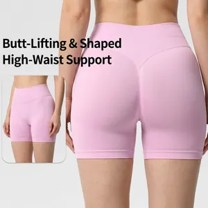 Pink seamless high-waisted yoga shorts featuring a peach butt-lifting design for fitness